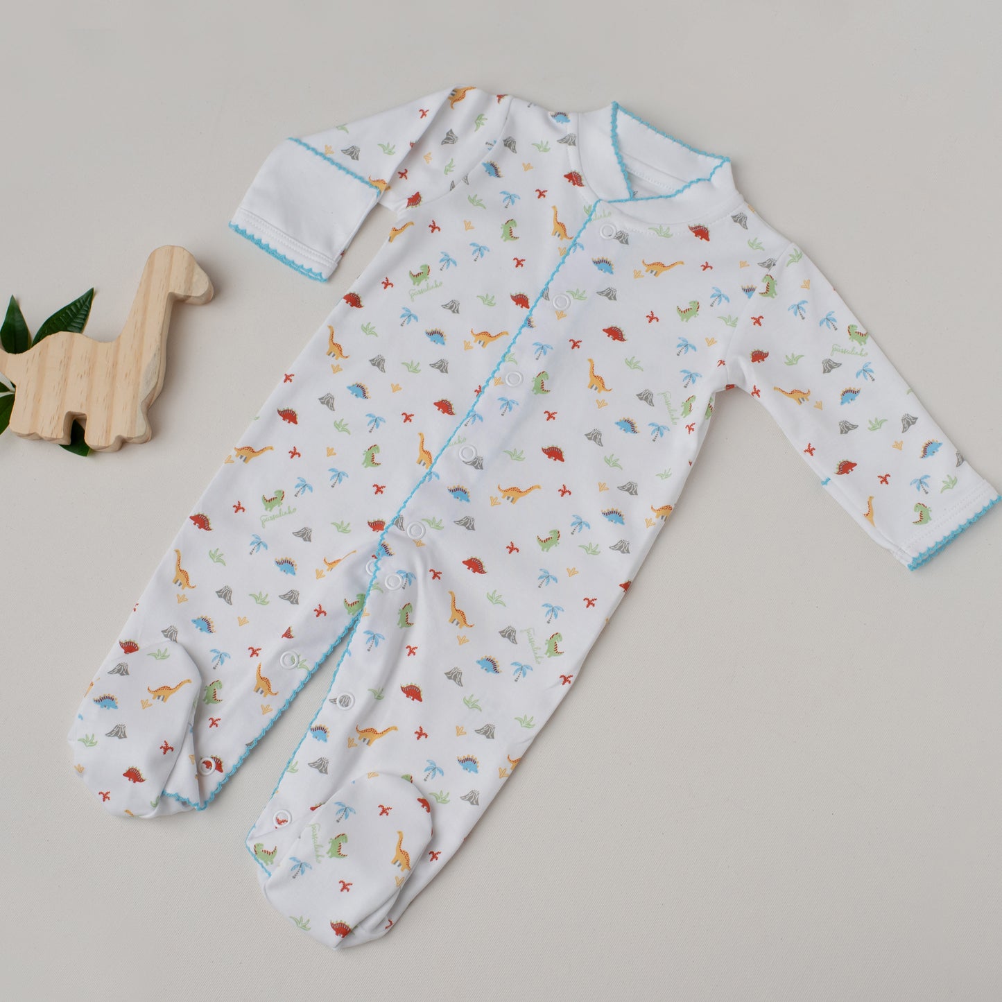 Macacão Arara Dinossauros