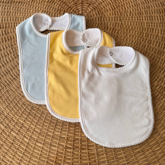 Kit: 3 Babadores Tucano Pima Atoalhado - Azul, Branco e Amarelo
