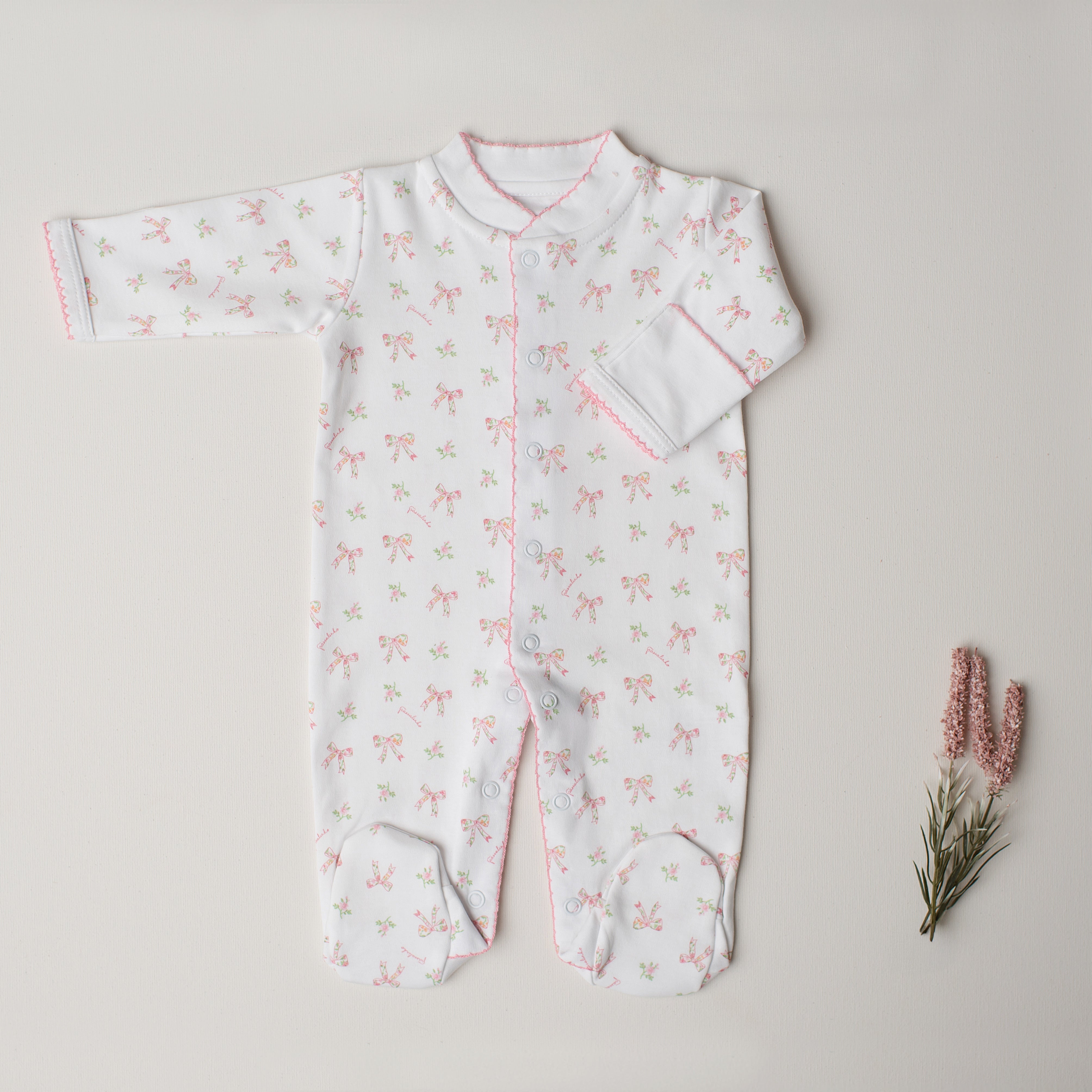 Macacão Arara Laços Rosa