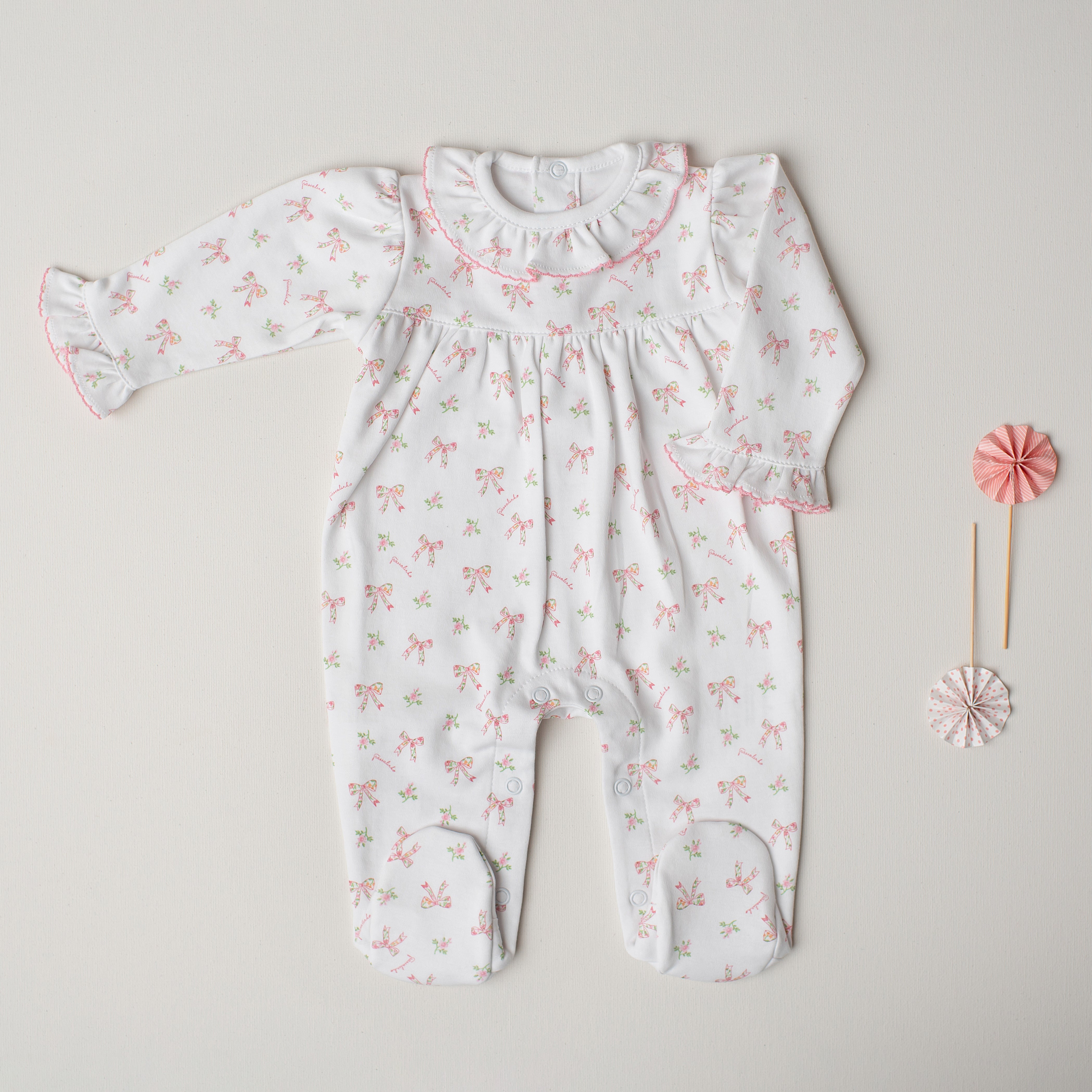 Macacão Quebra-Nozes Laços Rosa