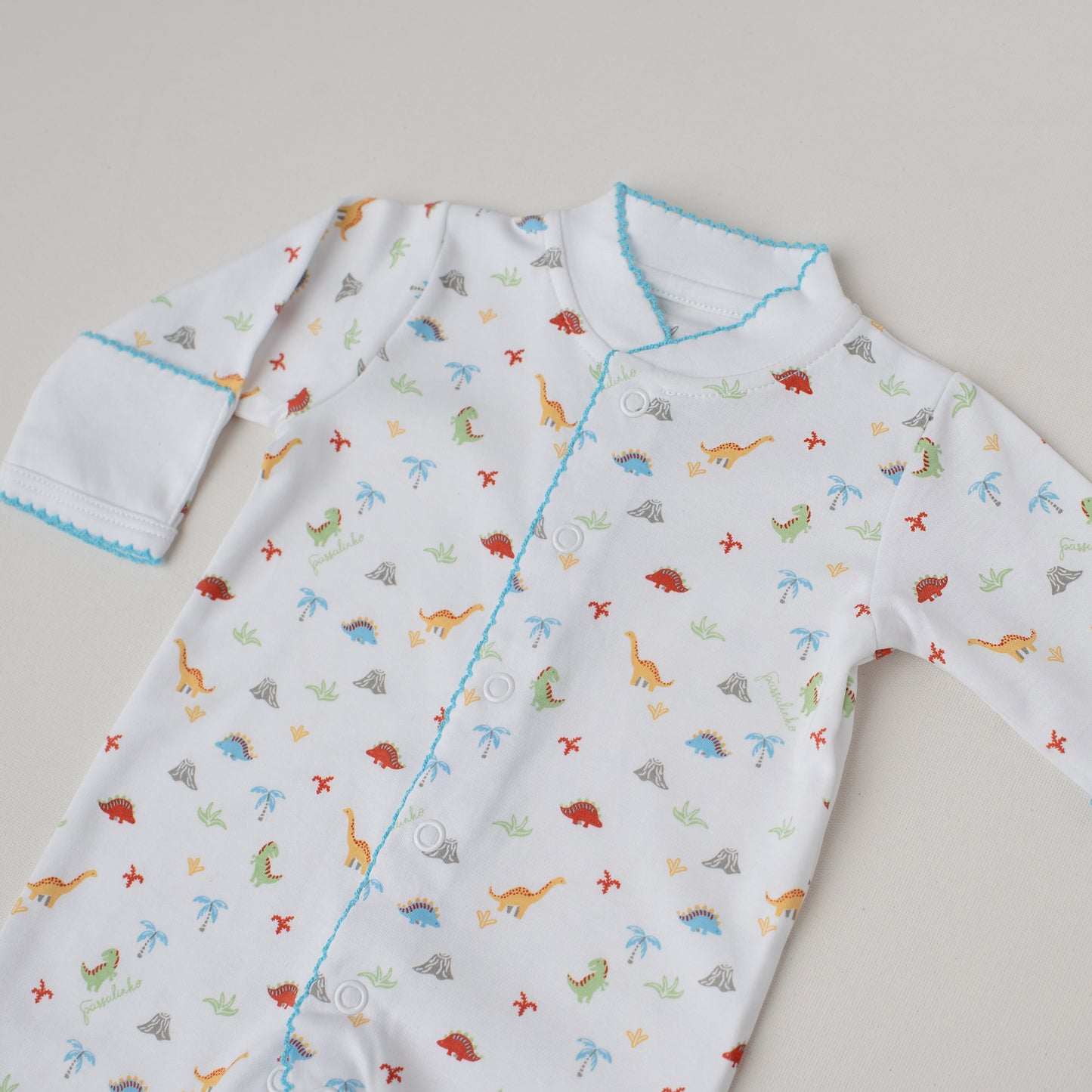 Macacão Arara Dinossauros