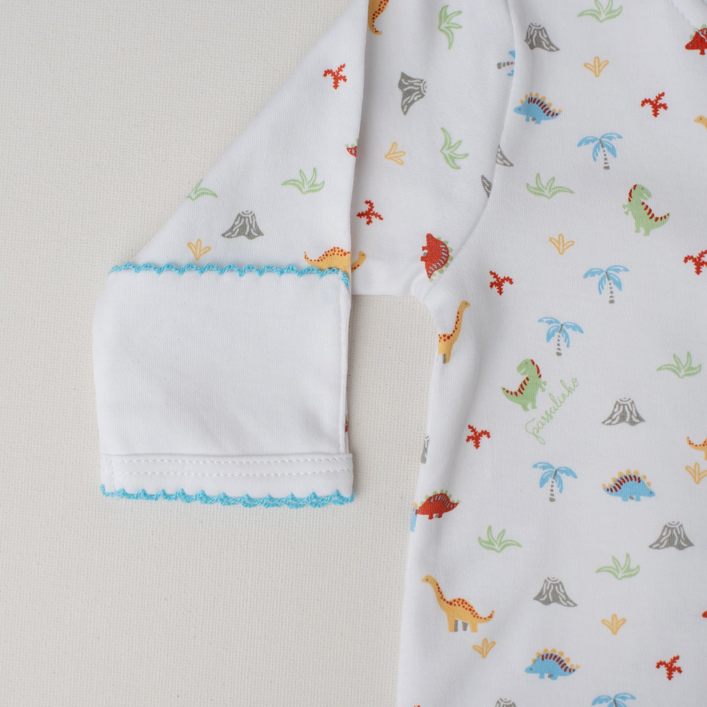 Macacão Arara Dinossauros